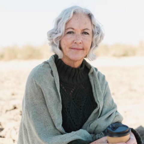 Well-lit, natural headshot of a senior woman